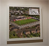 Premium Framed Cork Pin Board showing Aerial Photograph of Cheltenham Town - Whaddon Road Premium Framed Cork Pin Board showing Aerial Photograph of Cheltenham Town - Whaddon Road